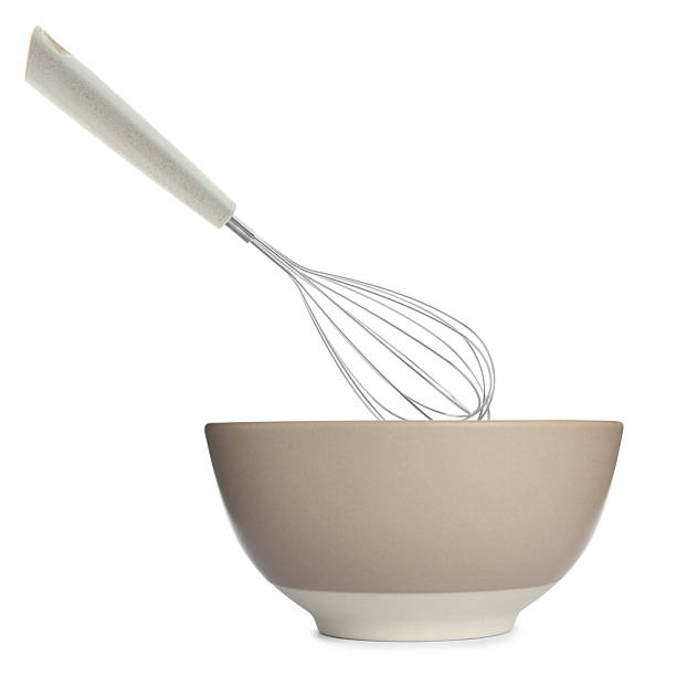istock Metal whisk and ceramic bowl isolated on white. Cooking utensils 2248136594