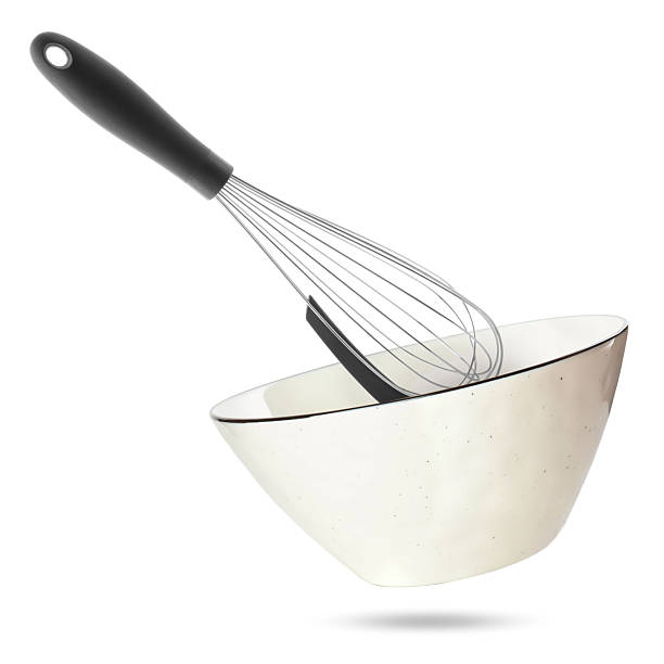 istock Metal whisk and ceramic bowl in air on white background. Cooking utensils 2248136597