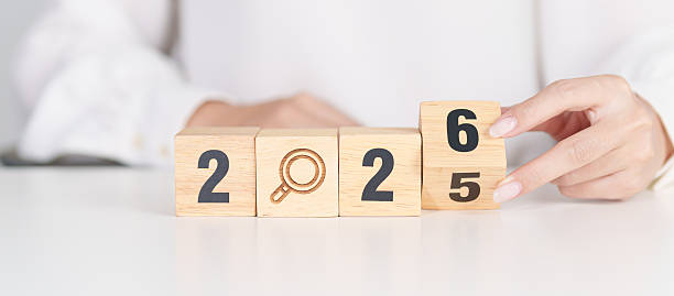 istock 2025 year change to 2026 year block with magnifying glass icon. SEO, Search Engine Optimization, hiring , Advertising, Idea, Strategy, marketing, Keyword, Content and New Year start concepts 2248138127