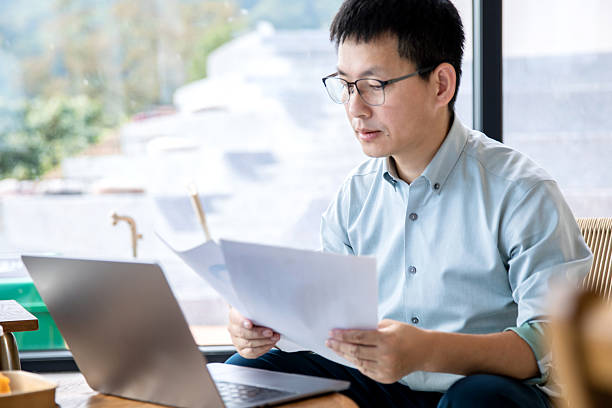 istock An Asian manager is reviewing financial statements on his computer. 2248142099