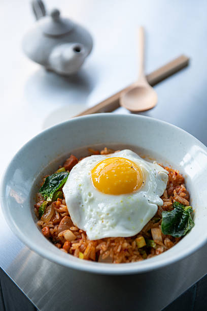 istock Delicious Kimchi Fried Rice Topped with a Perfectly Cooked Fried Egg 2248142310