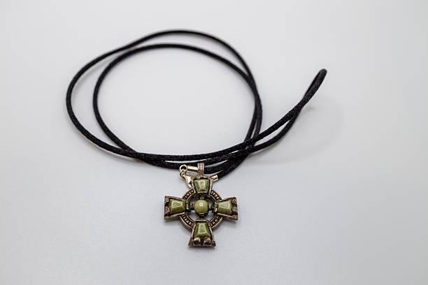 istock Vintage style Celtic cross pendant on white background 2248142962