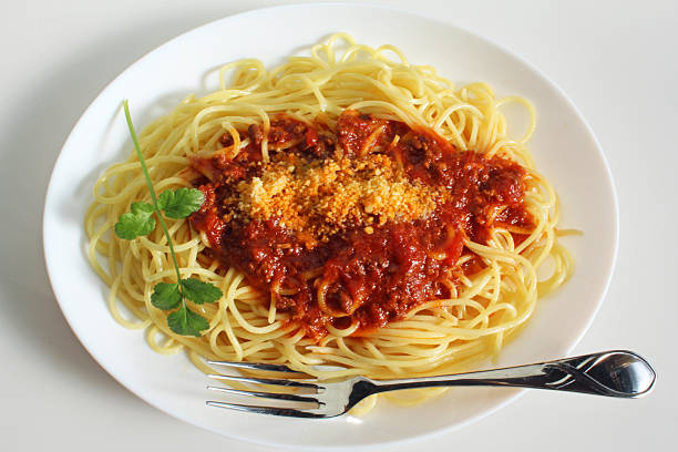 Bolognese spaghetti, topped with grated cheese