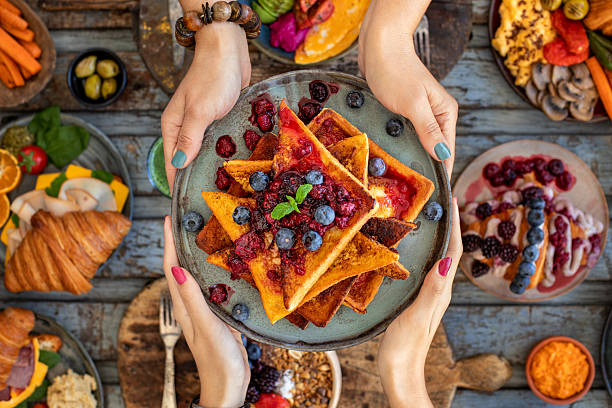 istock French toast with strawberries, blueberries and syrup & marmalade. Continental breakfast 2248146143