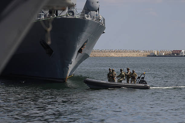 Constanta, Romania - September 1, 2025: Romanian Navy's special forces soldiers on a military inflatable boat.