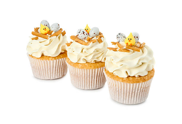 istock Tasty Easter cupcakes with vanilla cream isolated on white 2248148712