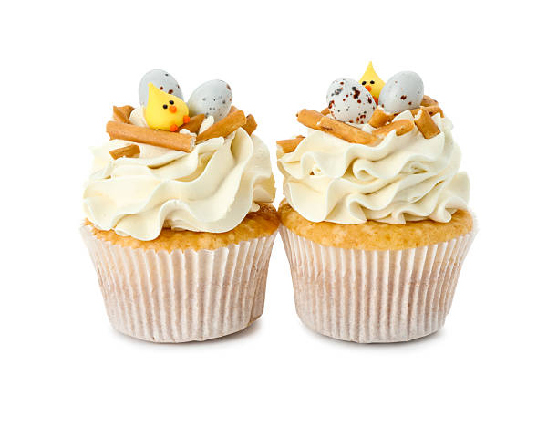 istock Tasty Easter cupcakes with vanilla cream isolated on white 2248148737