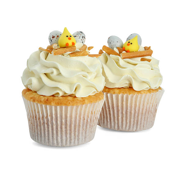 istock Tasty Easter cupcakes with vanilla cream isolated on white 2248148768