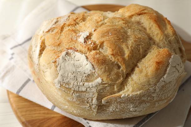 istock Freshly baked sourdough bread on white table 2248149994