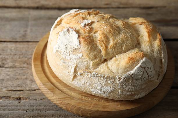 istock Freshly baked sourdough bread on wooden table 2248150040