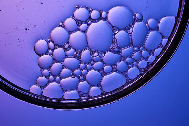 istock Bubbles in shampoo or shower gel. Texture on a purple background. 2248150285