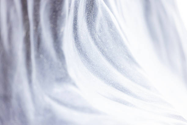 Closeup shiny stainless steel scratched sheet, abstract background with copy space, full frame horizontal composition