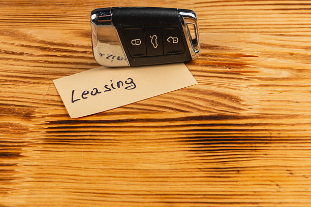istock Car key and leasing note placed on wooden surface 2248150767