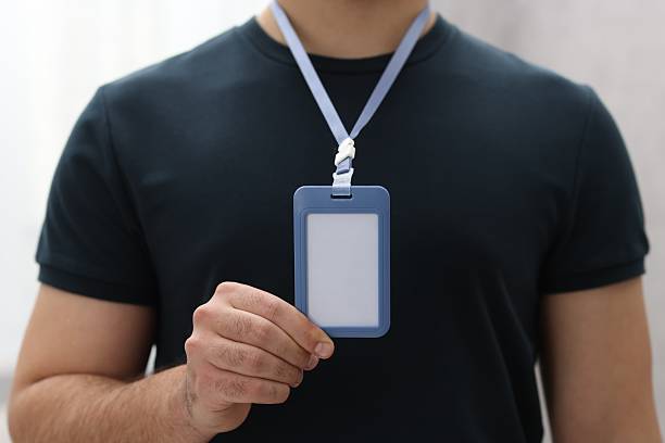 istock Man with blank badge indoors, closeup view 2248150844