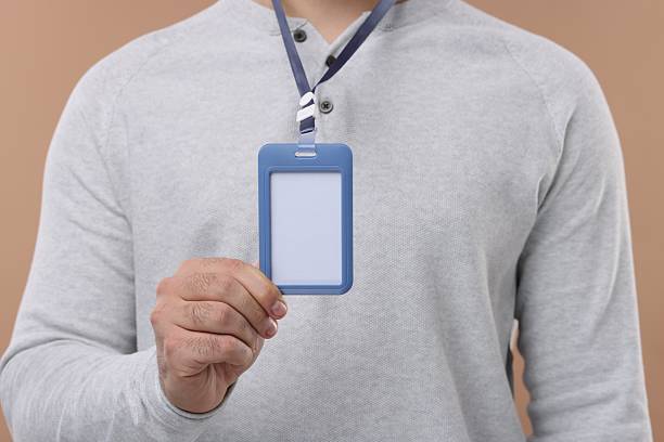 istock Man with blank badge on beige background, closeup 2248150851