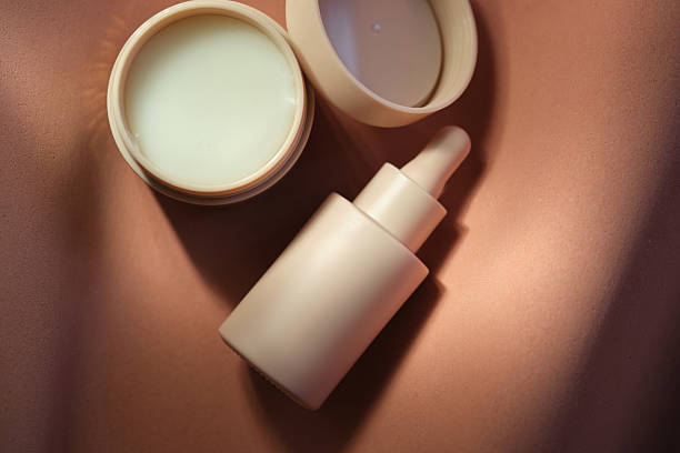 istock Face cream and serum on a soft beige background. 2248151345