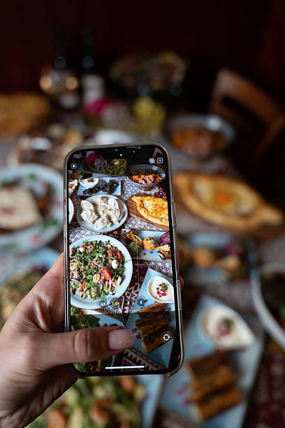 istock Capturing Food Photography on Smartphone at Festive Table 2248152086