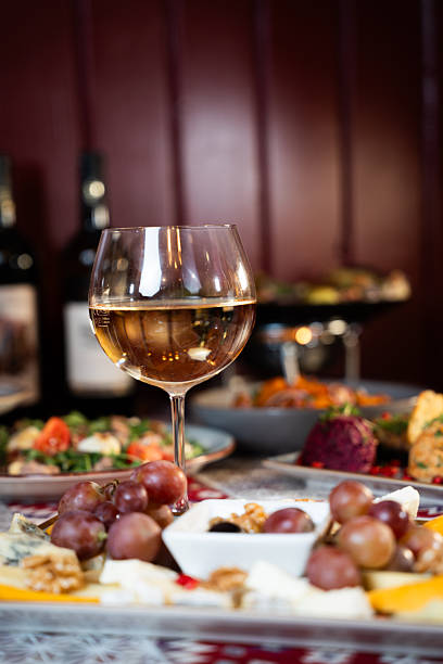 istock Glass of White Wine with Cheese and Grapes 2248152187