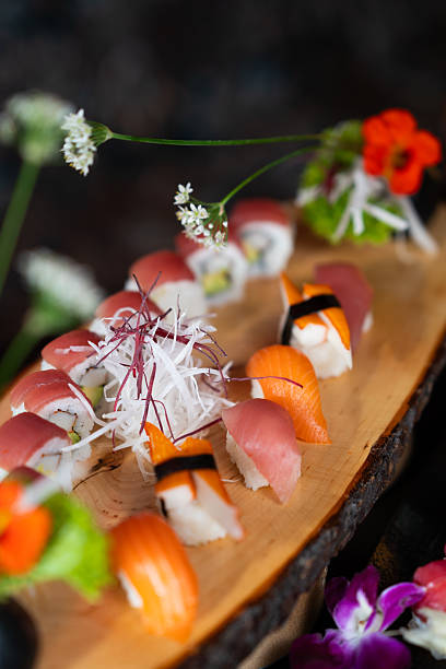 Sushi Assortment on Wooden Platter with Garnish