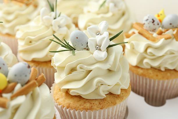 istock Tasty Easter cupcakes with vanilla cream in box, closeup 2248152689