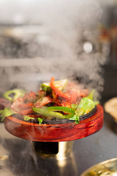 istock Steaming Hot Fajitas on Sizzling Plate 2248153730