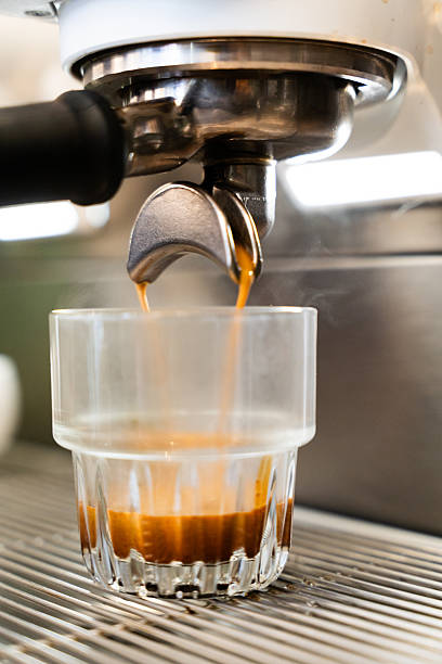 istock Fresh espresso pouring into glass 2248154124