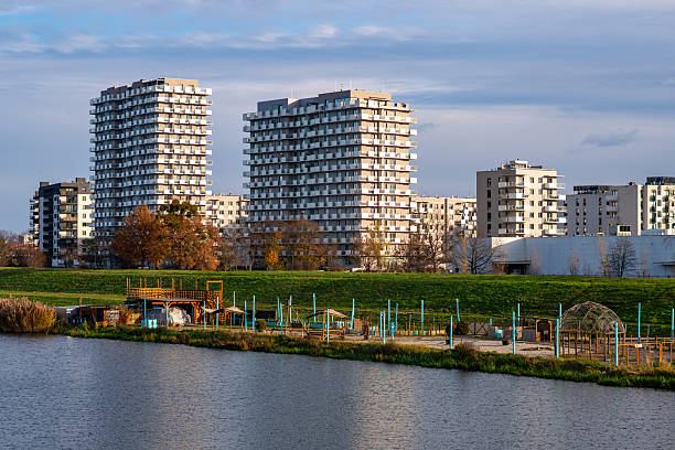 istock View of Wroclaw residential high-rises by the Oder River, with a green embankment and riverside recreational structures in the foreground 2248155121