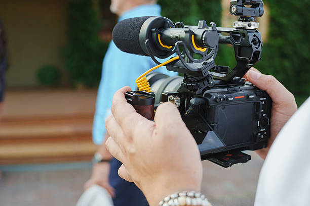 istock Filming a video interview outdoors in bright daylight 2248155516