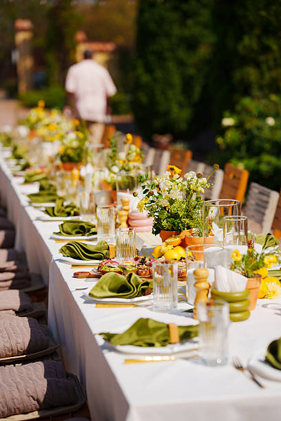 istock Elegant outdoor dining setup with floral centerpieces 2248156808