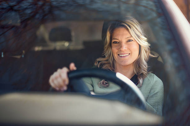 istock Happy woman enjoying while driving a car. 2248156854