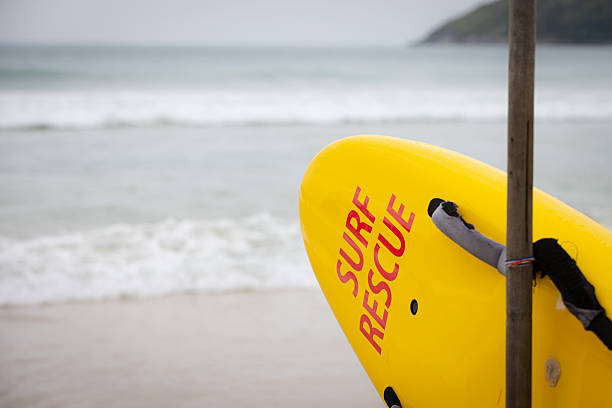 A white lifeguard tower stands on a sandy beach overlooking the ocean waves, ensuring safety along the picturesque coastline. Seen at Bondi Beach, Sydney, Australia.