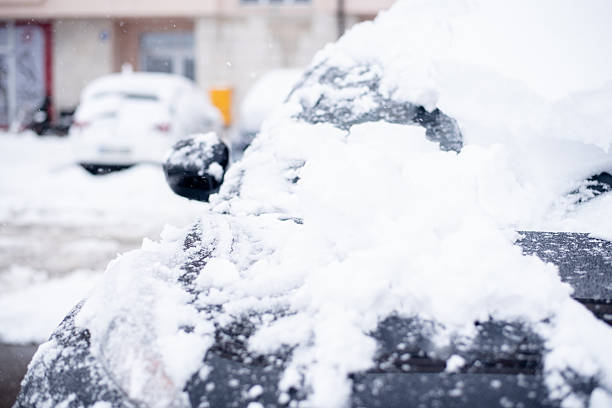 istock The side mirror of the car under the snow 2248157033