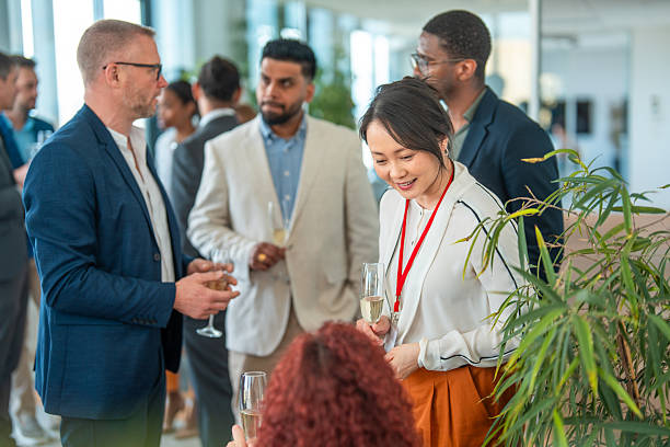 istock Diverse Group of Professionals Networking with Champagne in Modern Office 2248160473