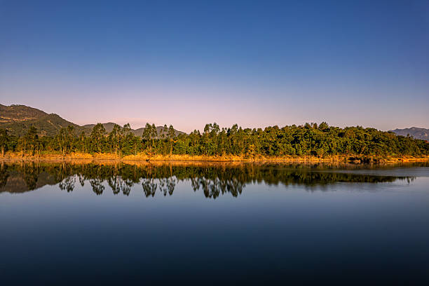 Sunrise Lake Reflecting Mountains and Forests