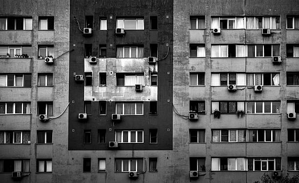 istock Urban apartment building facade with air conditioning units. 2248163559
