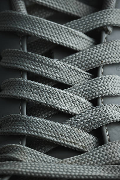 istock Close view of intricate shoelace weaving pattern 2248164182