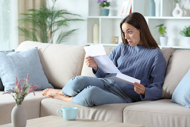 istock Perplexed woman in blue reading absurd letter 2248164705