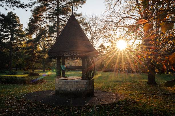 istock Stone well in a sunlit autumn park. 2248165869