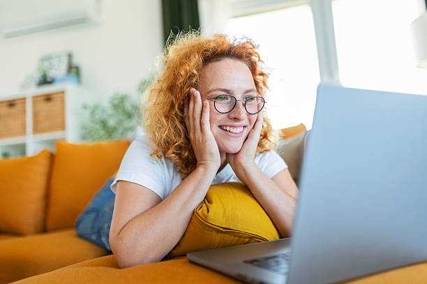 istock Woman with Red Hair Working Comfortably from Home 2248166345