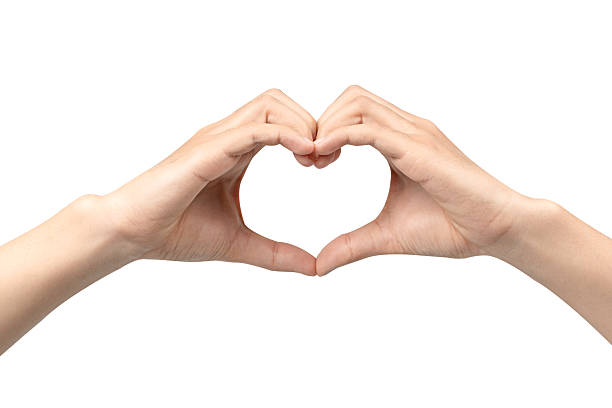 istock Two hands forming a heart shape (love sign) with the fingers joined together. Isolated on a pure white background, this gesture symbolizes love, care, friendship, support, romance, and charity. 2248166539