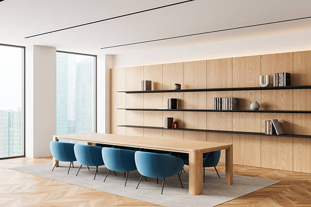 istock Modern minimalist meeting room interior with wooden elements, large windows, and blue chairs in bright corporate office concept design setting. 3D Rendering 2248167413