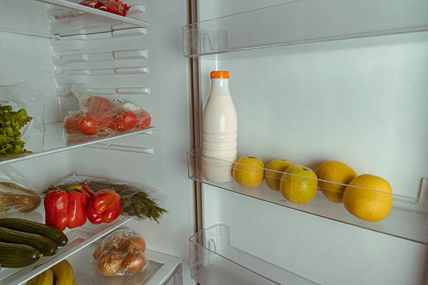 istock Fresh produce and dairy items neatly arranged in a refrigerator, showcasing vibrant vegetables, fruits, and a bottle of milk, emphasizing healthy eating and organization 2248168220