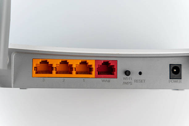 Modern network router features multiple Ethernet ports, power connection, and reset button, highlighting advanced technology and connectivity options for home or office use