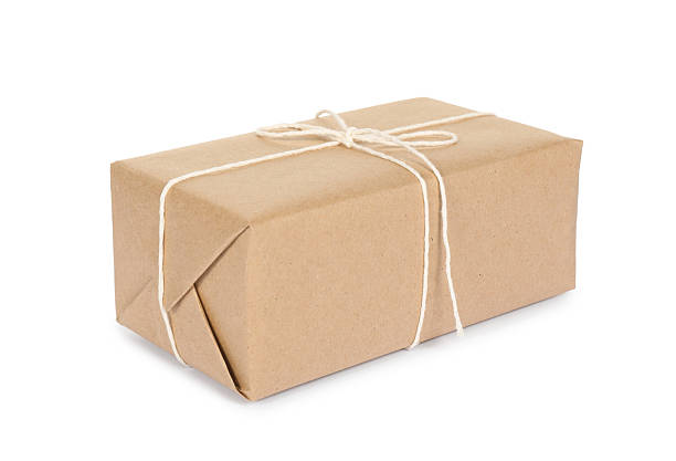 istock One parcel box wrapped in paper isolated on white 2248172881
