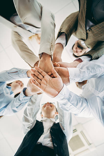TEAM representing Together Everyone Achieves More text on wooden stick