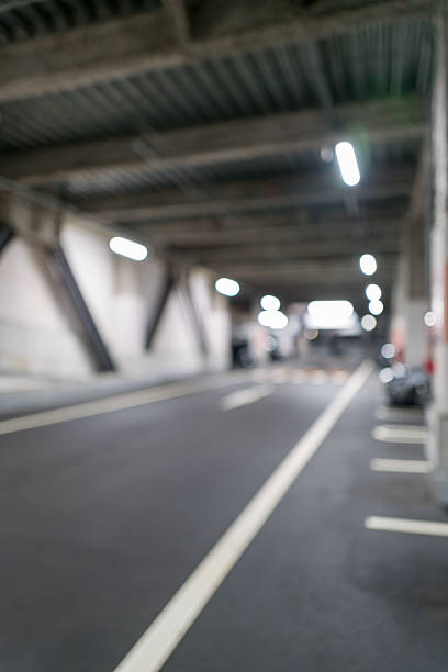 istock Blurred Underground Parking Lot Background | Perfect for Business Ads and Modern Design 2248174307