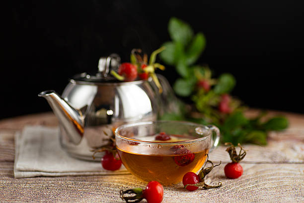 istock hot medicinal tea with rose hips in a cup on the table 2248176744