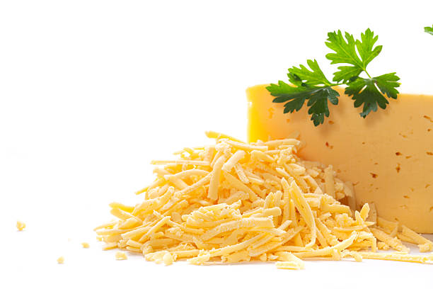 istock Shredded cheddar cheese with parsley on clean white background 2248176783