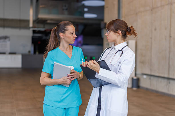 istock Two female healthcare workers having a discussion in a modern clinical setting 2248177126