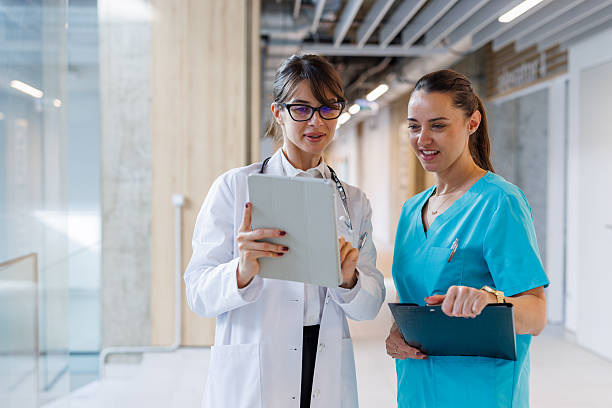 istock Healthcare professionals analyzing data on digital tablet in hospital 2248177397